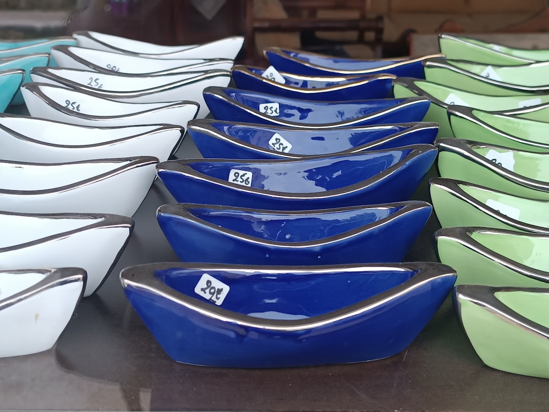 a-table-topped-with-lots-of-blue-and-white-bowls-x1qvrogtm-c